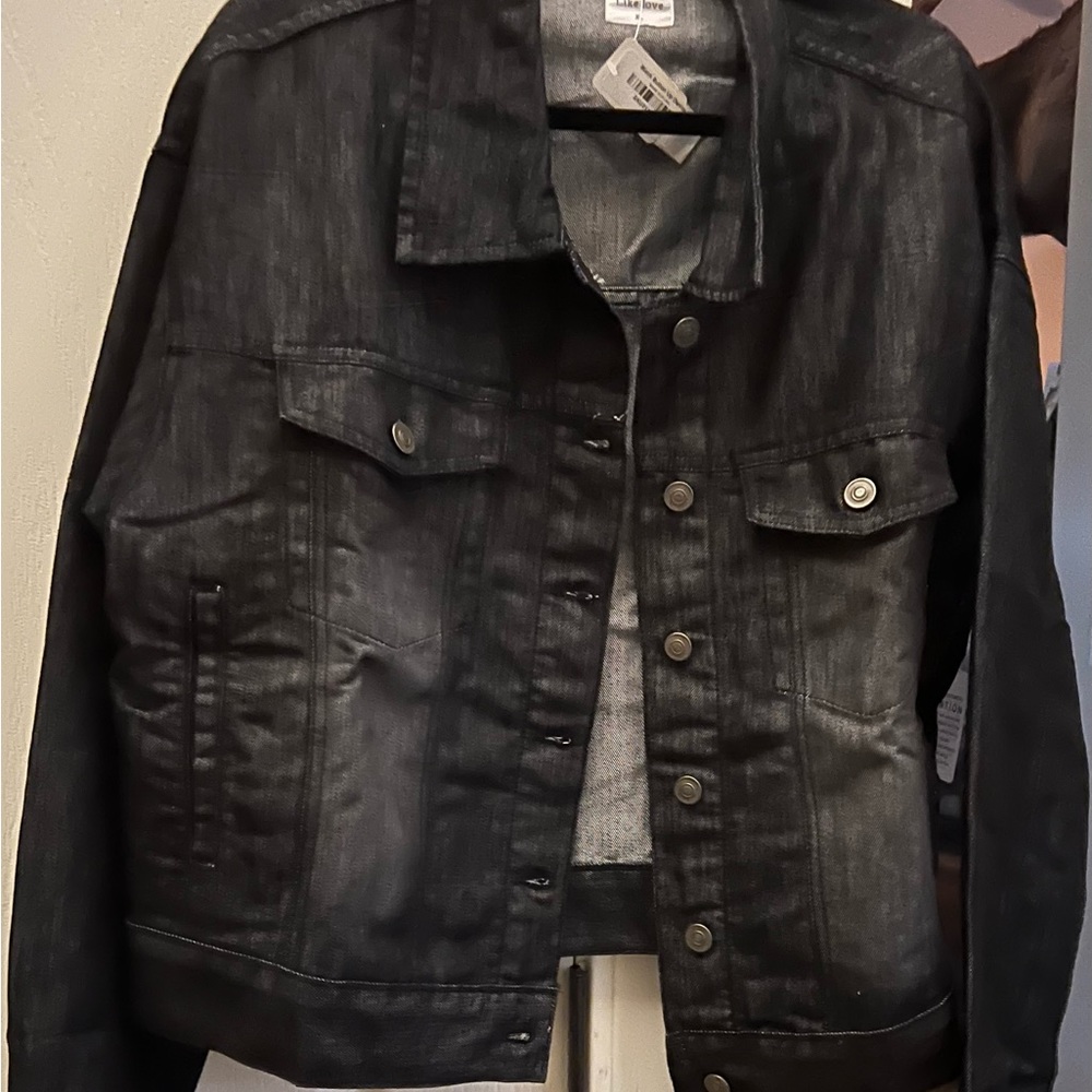 Dark jean jacket. New too big for me.